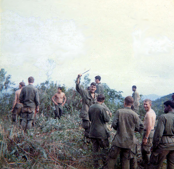 Group conference
Looks like he got the long stick instead of the "short straw".   Another day in the bush with members of the 1/14th Inf Regt.
