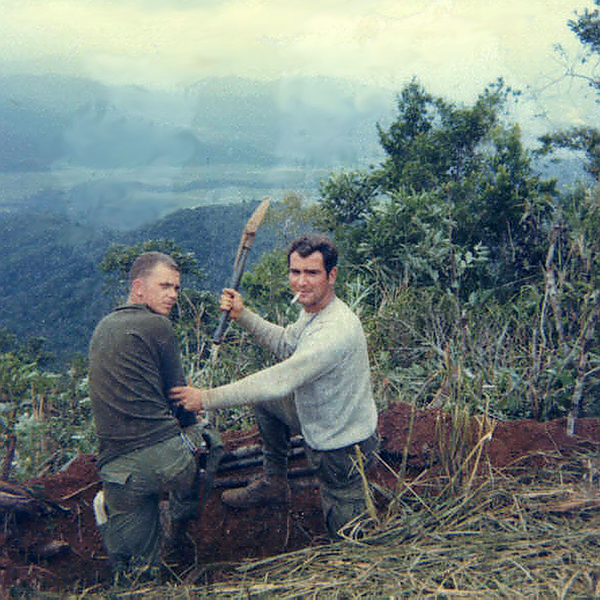 Entrenching Tool
The US Army entrenching tool....the time-honored way to dig your hole and doubles as a weapon also.  

Actually, I was warning the Capt Jerry Roberts, the "B" Company commander, (at left) to get us out of the f-g mountains...it was too g-d cold!
