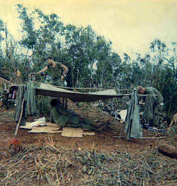 Tenement Tent
Don't think you'll find this method of tent erection in a Field Manual.  That's our medic, "Doc" Brown, behind this shelter.
