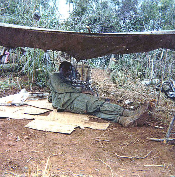 Roughing it
{UNK} getting out of the sun.  Cardboard often separated troops from the ground.
