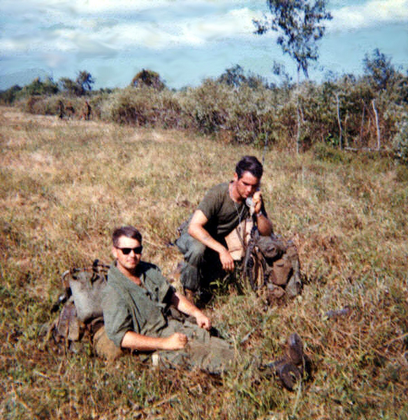 Calling Home
Where are we, anyway?  FO Lt Joe Hannigan takes a break with RTO Rick Ericksen on the horn.
