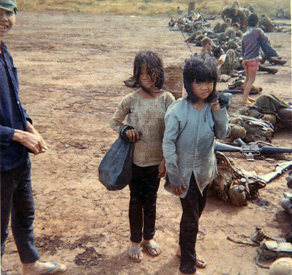 The children of war
Local villagers mingle with the troops.  As we moved round and about, the kids and adults were either looking for "freebies" or were trying to sell you something.
