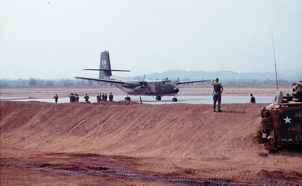 "Bye-Bye"
Lt Bird, 1/69th Armor, stands on the berm, waving good bye to the visiting VIPs.
