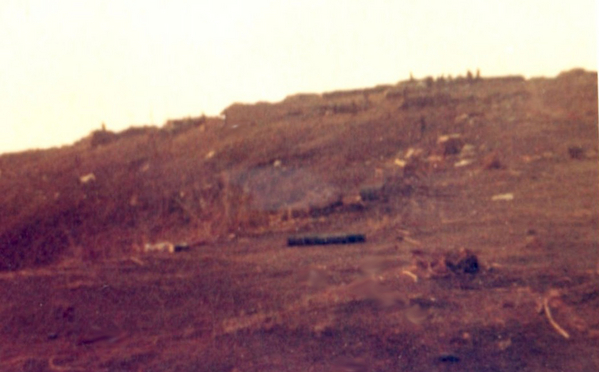 Nothing grows on LZ Incoming?
This is a "gook's view" of LZ Incoming from the south.  I braved the snipers & mortars to get water from the big bladder that was sitting out about 200ft out of the perimeter.  Anyone wonder why there was NOT a stick of vegetation on this firebase?  "Orange"-something ring a bell?
