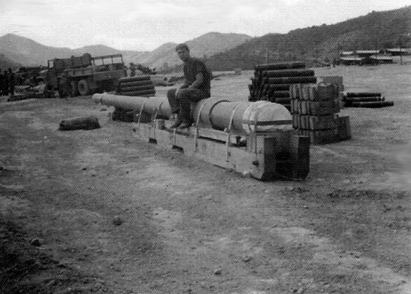 Spare Tube
Here I am sitting on a spare tube for the 175mm gun.  Due to their compression and long-distance firing, the tubes didn't last very long.
