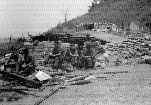 Taking a break on LZ Meade
The FDC crew taking a well-deserved break in front of the FDC bunker.  From Left to Right: Pete Beringer, Greg Malnar, Lou Onarato, Jimmy Loy, Mickey Mattocks.
