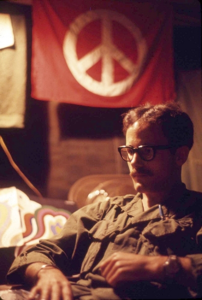 Peace, Brother
A pensive Jeff LaBreck sits in front of his "peace" flag.  It went by other names, too.
