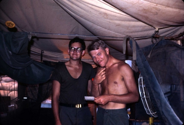 Me & Moon
Smiling for the camera.  Me and John "Moon" Mullins in our tent.  That device that Moon is holding in his left hand was for use back when he had hair.
