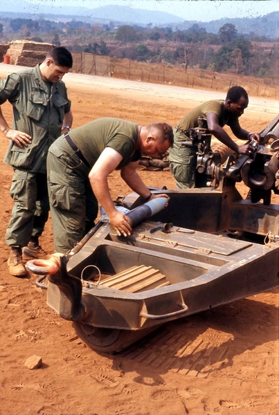 Load 'er up!
Getting ready to load a round into the breech.  Note the fuze-setting tool next to the round.
