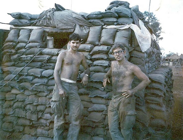 Moving Time
Another move, another 1,000 sandbags.  Think we got a little muddy in the process.  Next to me is Joe Goldstein with those ever classic military style glass frames.
