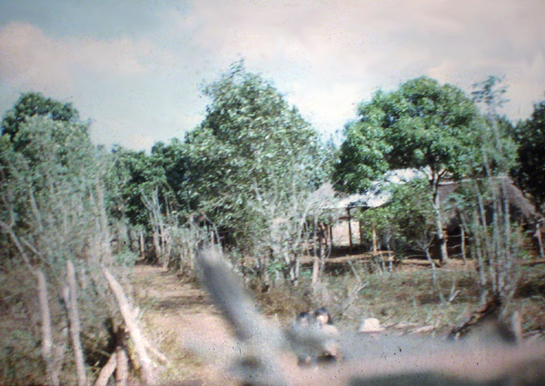 On The Road
Taking pics as we were riding by.  Note two small Vietnamese children at lower right.
