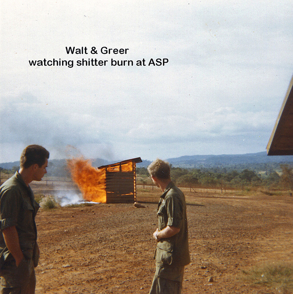 Sludge Duty
Walt and Ed Greer watch the shitter burn.  Best done at a safe distance away.
