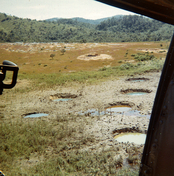 Fired for effect
Rain water fills in artillery impact holes.
