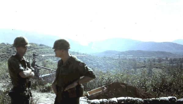 The "Boss" goes to the field
LtCol Bruce Holbrook. 2/9th BnCo, chats with "A" Battery Commander Captain Mike Casp (KIA in Nov, 1967) after landing at LZ OD.  His C&C chopper can bee seen behind them.
