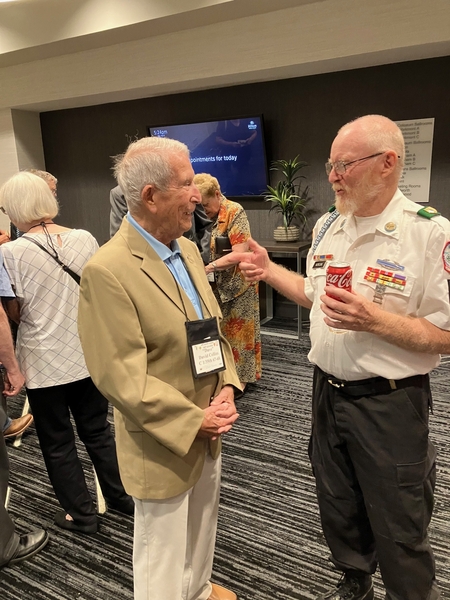 Got him again!
This time, Sgt John Morgan points the finger at Capt Dave Collins.  But this time it is just friendly banter.  John served in the Saturday night Banquet ceremonies with the Color Guard.
