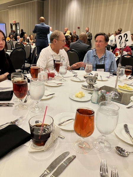 "Just Be Patient"
Bert Landau (2/9th FA) seems to be telling his son Dr John Landau to "be patient" as the food service was slow in arriving.  The choices of the night were chicken or beef tips with orange sherbet for dessert.
