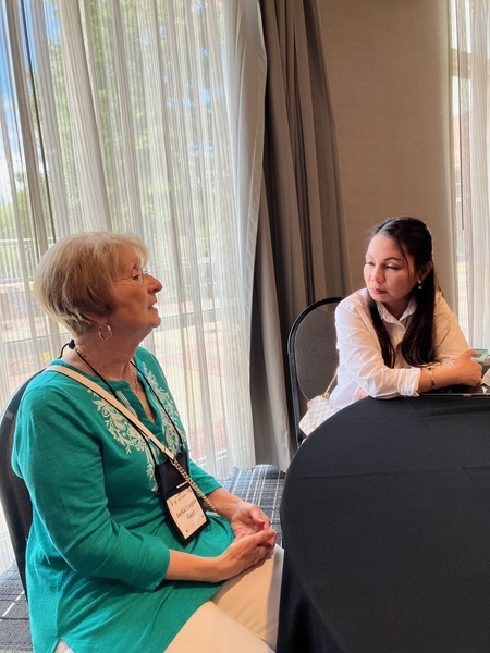 The FO wives
Jackie Dauphin and Mercy Kurtgis chat in the Hospitality Suite.  Their husbands were Forward Observers (FO) serving with the 2/9th FA in support of the 35th Infantry Regiment.
