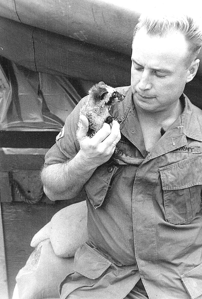 Sp5 Barber, Bn FDC at Duc Pho
Sp5 Barber holds a furry friend...a lemur.  You never knew what you would find in Vietnam!
