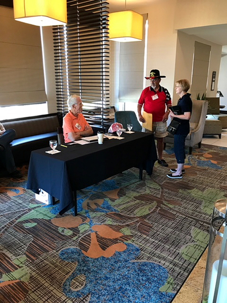 Arrival Day, May 9, 2018
2/9th FA Webmaster Dennis Dauphin and wife Jackie check in at the Registration Desk with John "Moon" Mullins.  The "Grand Finale" rooms were booked with the Hilton Garden Inn in downtown Lawton, close to Ft Sill, OK.

Photo courtesy of Wayne Rayfield
