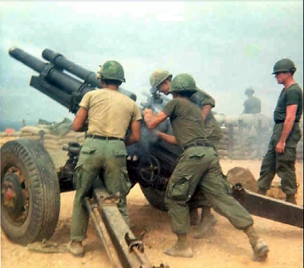 A Working Crew
The fire mission continues.  I don't think Ft Sill allowed cannoneers to straddle a trail; they kinda frowned on that.

Casteel, Martinez, me and Reedy working the cannon.
