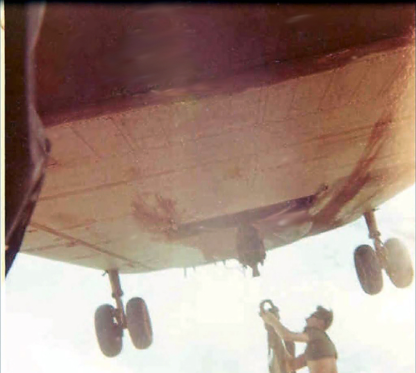 Expert Chopper pilots
This Chinook pilot laid the back wheels of his chopper on a personnel bunker while Sandy is hooking up the donut.  I'm inside the bunker taking the picture.
