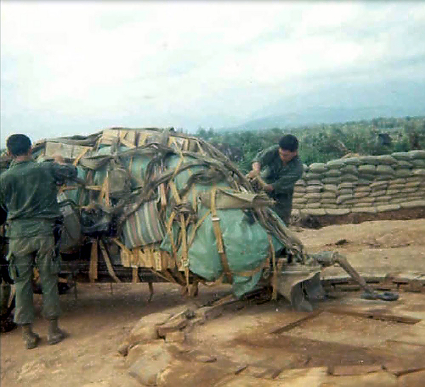 Leaving LZ Colt
Casteel and Martinez tighten the load to leave the LZ.
