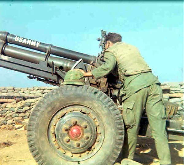 Checking the sights
Elmer Lindsay (KIA) is looking through the Gunner's sights.
