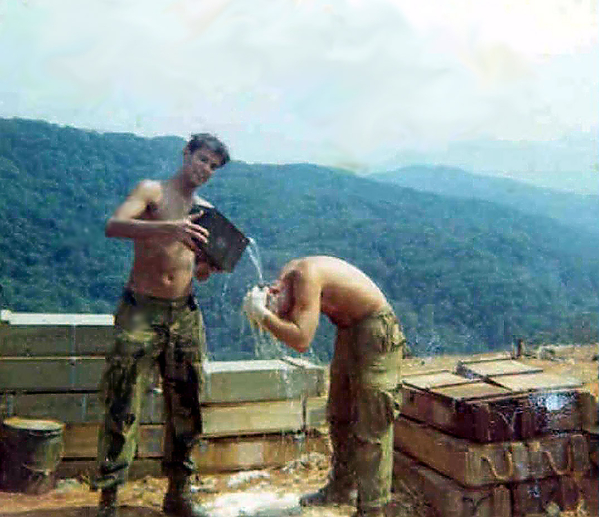 Cleaning up
Bob Becker and Danny McMillan are cleaning up 20 minutes before the first recoilless rifle round hit the firebase.
