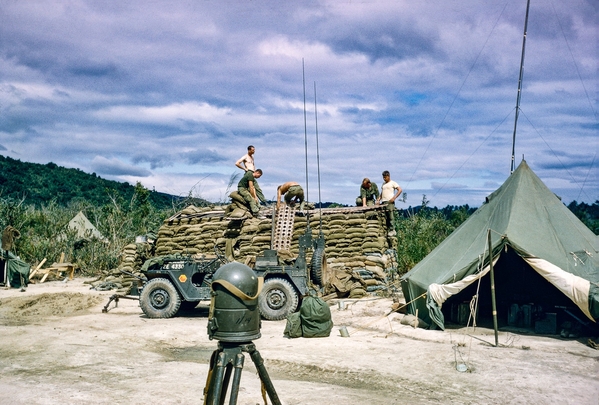 Bunker Building
All the elements are there: Aiming Circle, Jeep, sandbags stacked and augmented with steel grating.
