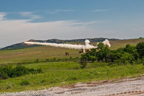 Thursday Firepower Demonstration
The Artillery Rocket fired to its ridge line target at amazing speed.

Photo courtesy of Doug Turner
