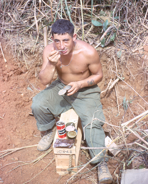 Beer & Beans?
Scotty takes a meal break.  Notice forearm tattoo.  This dude was way ahead of his time.  According to Lt Wayne Crochet, Scotty was indeed from Scotland, came to the US to visit his sister, and somehow wound up getting drafted.  Bad timing indeed.
