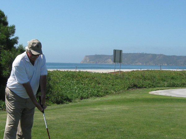 J Fred Oliver
Redleg J. Fred Oliver of the 2/9th, a resident and developer in San Diego, tees off on the back nine.  Note the landmark called "Loma Point" sitting out in the Pacific.  This is truly a scenic golf course.  Fred coordinated with Don "Doc" Johnson in getting tee times for the golfers.
