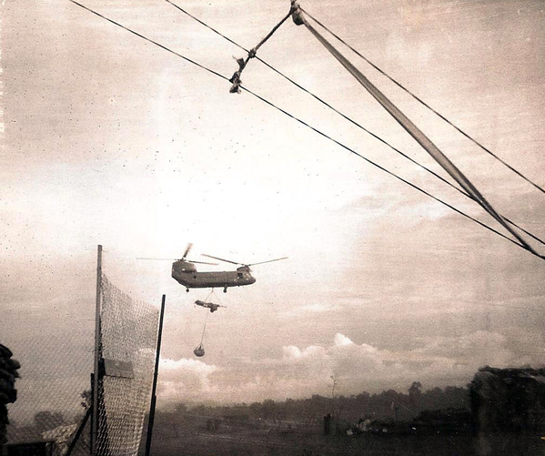 Move to LZ Red Fox
This photo and the next are of a shithook lifting a gun and net with 10 rounds and stakes to set up for firing as soon as landed.  I wasn't a cannon cocker so I don't remember the name of the delicate gizmo for the gun, which went in with advance party to the new LZ before the guns were lifted.
