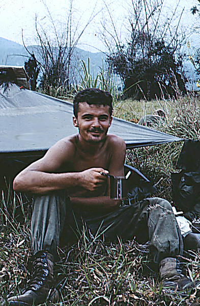 My Friend
He's putting that canteen cup to good use.  Good shot of typical living quarters in the boonies.
