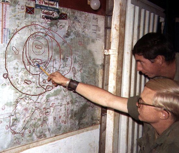 "Our last contact was here..."
Billy Williams points to the spot while Joe stares intently.  The TOC room map was the key to planning and strategy.
