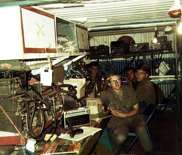 TOC loaded with radios
(Back) Terry Savely, 2/35th Commo; Billy Williams, UNK, and Bob Smith, 2/35th RTO.  The Tactical Operations Center kept tabs on everything via radio.
