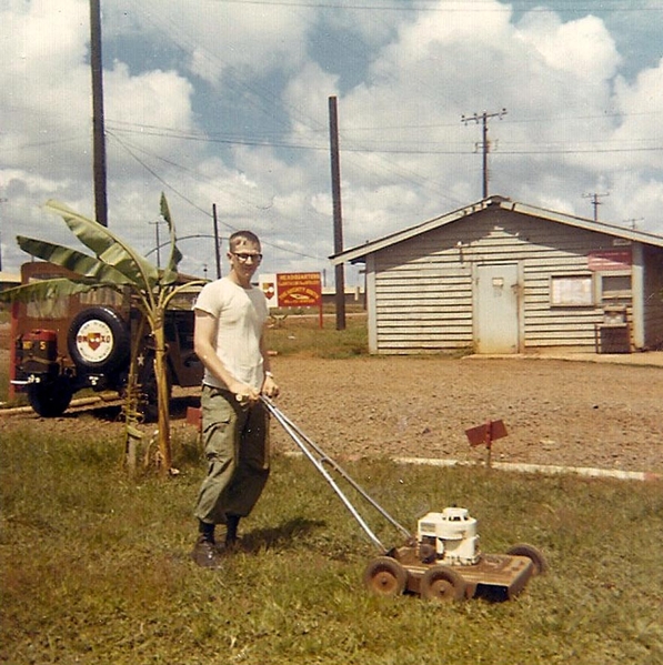 Landscaping in Vietnam
Yeah, we had to cut the grass at Bn Hq.  Makes for a very strange looking sight. 2/9th Arty Hq sign in the background.
