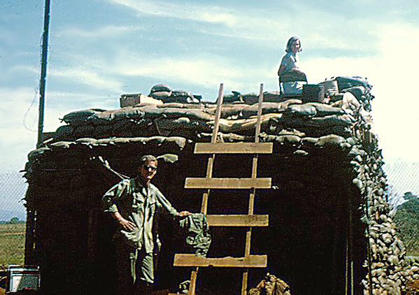 Getting a better view
Jenny climbed to the top of the sandbagged structure (FDC?) to get a better view.  Jenny visited several firebases in the FIELD, not sitting in the rear areas like a lot of well-publicized celebrities who went to Vietnam.  Jenny and her cohorts were brave enough to go meet the men who did the fighting, not the ping-pong players in the rear.  She feels pretty sure that this photo was taken at LZ St George.
