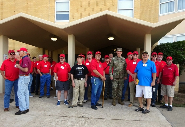 Arrival
"Hail, Hail, the gang's all here..."  We arrive and venture out into Ft Sill.  Posing in front of the former "Hi-Rise BOQ", now a Holiday Inn commercial establishment.  {Please see "We Were There" individual photos on the web Homepage}

Photo courtesy of Joe Henderson.
