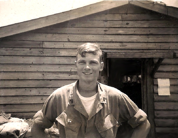 Why Is This Man Smiling? Because he is going home!
Because it's April 10, 1970 and I'm getting out of Dodge.  Had another white tee shirt in my AWOL bag that had been in storage at Enari and they gave us new boots and jungle fatigues.  Getting ready to board a bus to the Pleiku Airbase and hop on the big Air Force jet with 71 other guys to accompany the colors of the 3rd BDE to Ft. Lewis, Washington.  We were all E-5 and above or O1 or O2s.    No one knew how or why we were selected, but in trying to puzzle it out we decided that apparently the primary qualification was having over 10 1/2 months in country, holding the ranks someone thought appropriate, able to clean up well, and capable of being retrained to march.  Enari had been moved over to Radcliff, so to the best of our knowledge the 72 of us, minus confiscated weapons, were alone inside the huge basecamp with just the 1/12th (no offense intended) the worst battalion in the brigade sleeping a couple of guys in every 2nd or 3rd perimeter bunkers.
