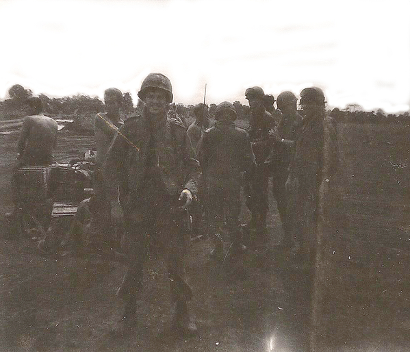 Likely taken around Sept/Oct, 1969.
Not sure where or when.  Probably Sept/Oct '69.  Getting ready to go out again (since I am wearing the flack jacket must be lifers in the background).  Can't make out the folks behind me.
