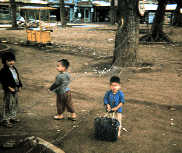 Pleiku series
Must be friends of the boy in the previous photo in the barbed wire playing or going to market.  This one has a basket.
