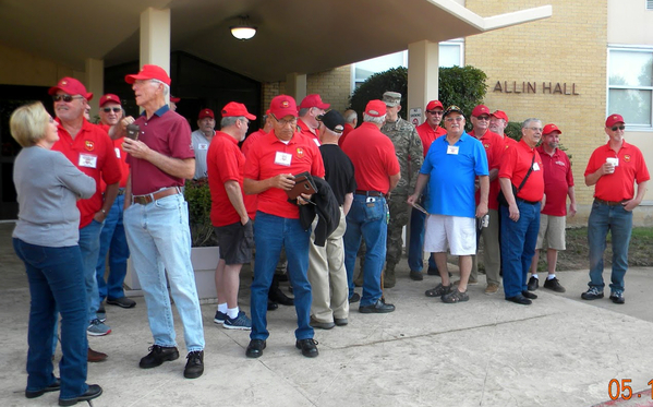 Arrival
Arty caps and shirts cover the landscape in front of Allin Hall as we gather for the first day of Agenda events as organized and arranged by Host Jerry Orr.
