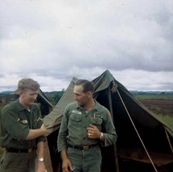 Wilson and Roufs
Pfc Wilson and Pfc Gordon G. Roufs outside the tent.  Looks like Wilson got a tetanus booster shot.
