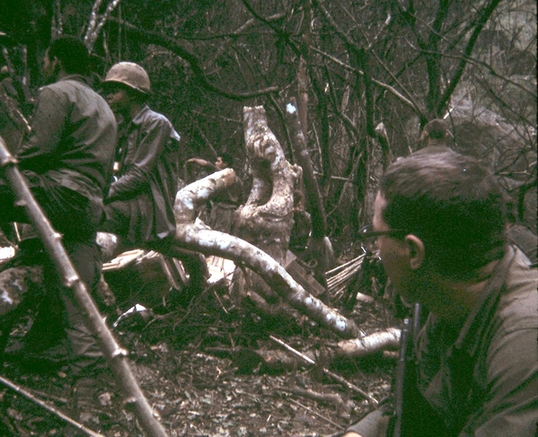 Checking out the caves
Surveyor Chuck Peart (foreground) hanging out with some of the soldiers of the 1/14th Inf Regiment.  We were called in after they found the caves.
