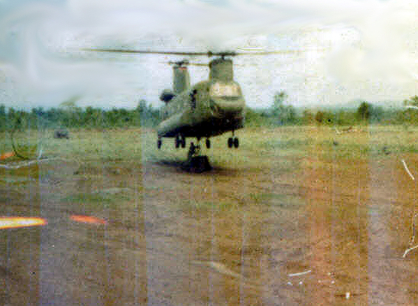 Memories of LZ St George
Chinook lifting off with its load and the "volunteer" hooker located underneath.
