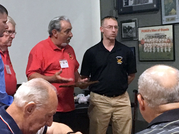 Presenting a Plaque
2/9th FA Webmaster Dennis Dauphin presents a plaque honoring LtCol Elliot Harris for his stupendous hospitality shown to our brother redlegs at our closing banquet

Photo courtesy of Steve Cox
