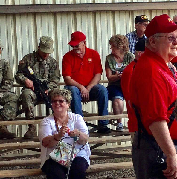 Firing Range
Barbara Bowden enjoys the firing range activity.  J. William Ward admiring the new M-4 rifle held by a trainee.

Photo courtesy of William Ward.
